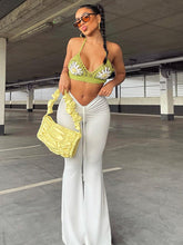 Plissierte Hose mit weitem Bein und niedriger Taille